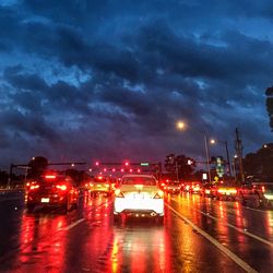 Cars moving on street at dusk