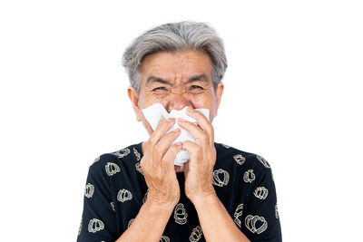 Portrait of man wearing mask against white background