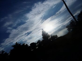 Low angle view of silhouette trees against sky during sunset