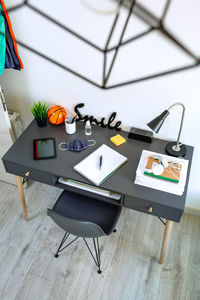 High angle view of desk with various equipment