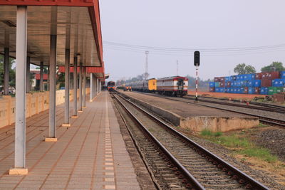 Railroad station platform against clear sky