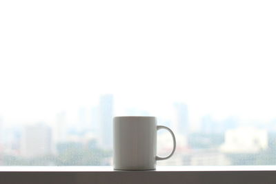Close-up of coffee cup on table