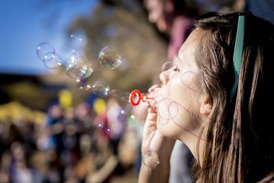 Close-up of hand holding bubbles