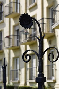 Close-up of street light against building