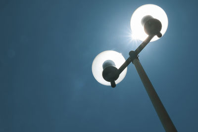 Low angle view of street light against sky