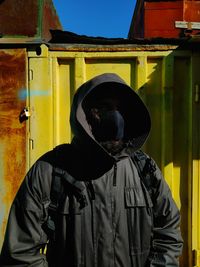 Full length portrait of person wearing hat outdoors