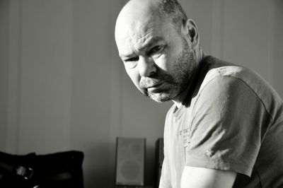 Portrait of man looking at camera at home