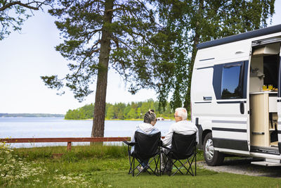 Senior couple camping by sea