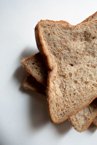 Close-up of bread against white background