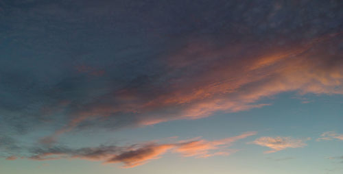 Low angle view of dramatic sky during sunset