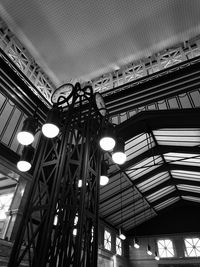 Low angle view of illuminated street light against sky