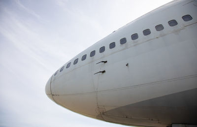 Low angle view of airplane against sky