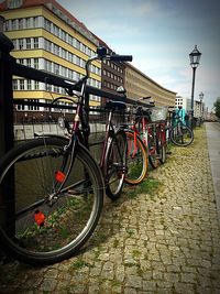 Bicycles against sky in city