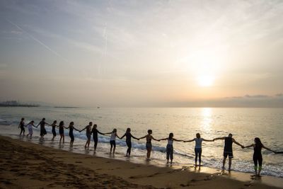 Scenic view of beach against sky during sunset