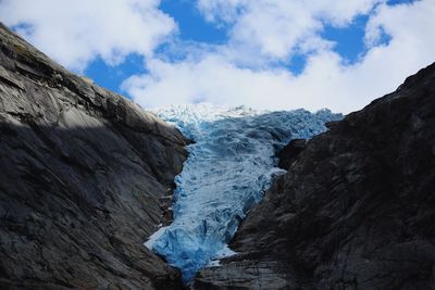 Scenic view of glacier against sky