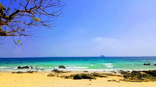 Scenic view of sea against blue sky