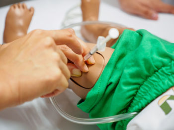Midsection of person wearing high angle view of hands