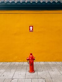 High angle view of woman standing on wall