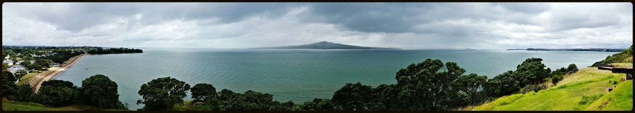 Panoramic view of sea against cloudy sky