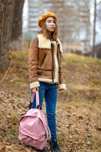 Portrait of girl standing outdoors