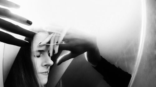 Close-up portrait of woman smoking cigarette