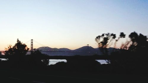 Scenic view of mountains against sky at sunset