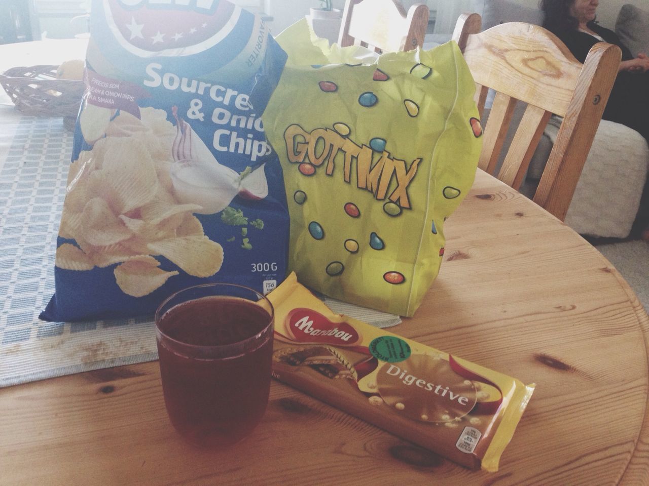 indoors, table, still life, wood - material, high angle view, text, communication, book, art and craft, paper, education, wooden, creativity, art, western script, close-up, food and drink, chair, home interior, no people