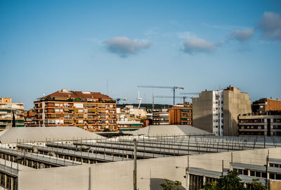 High angle view of buildings in city against sky