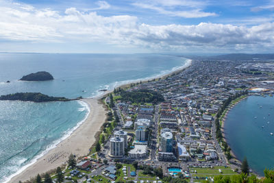 High angle view of sea and buildings against sky