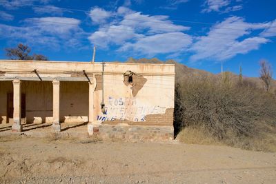 Exterior of old building against blue sky