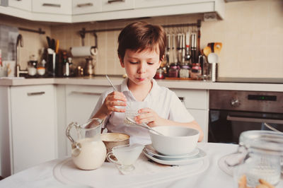 Boy sitting at table