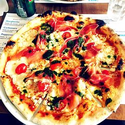 Close-up of pizza served on table