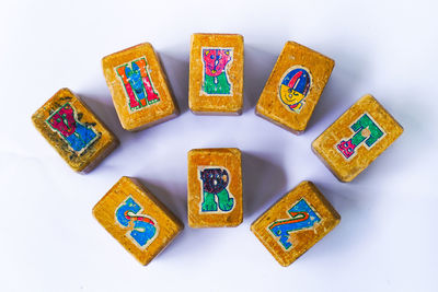 High angle view of toys on table against white background