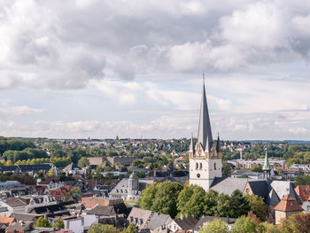 Church in town against sky