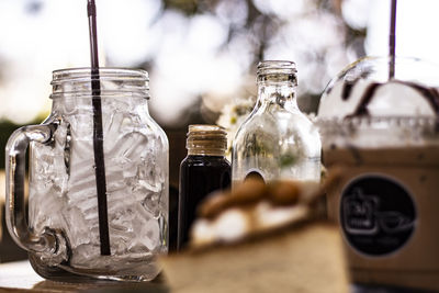 Close-up of drink in glass jar on table