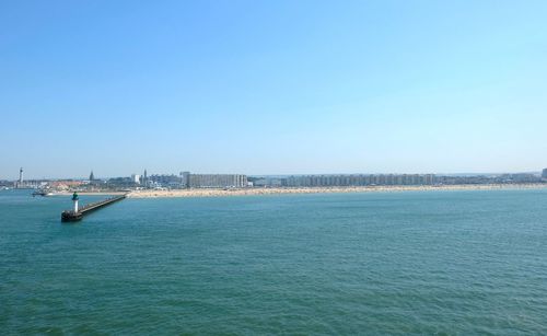 Scenic view of sea against clear blue sky
