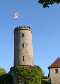 Low angle view of castle against clear blue sky