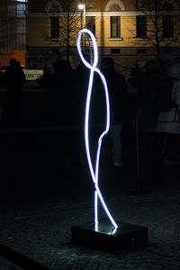 Light trails against building at night