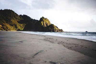 Scenic view of beach against sky