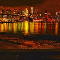 Illuminated city at waterfront