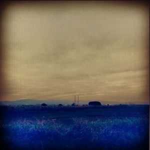 Scenic view of landscape against sky at sunset