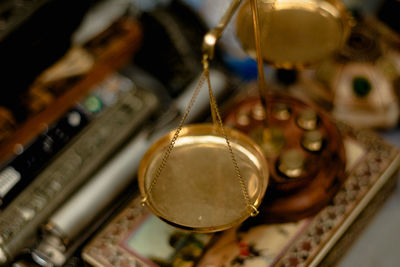 Close-up of electric lamp hanging on metal