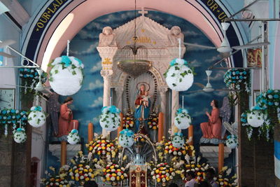 Statues in temple outside building