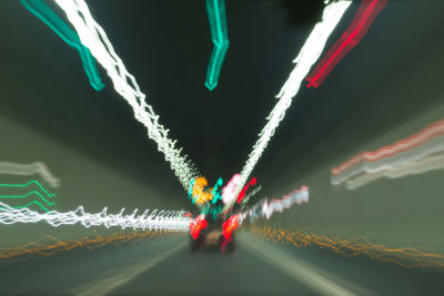 Low angle view of illuminated lights at night