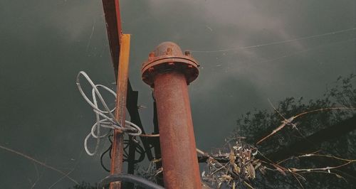 High angle view of metal pole by lake