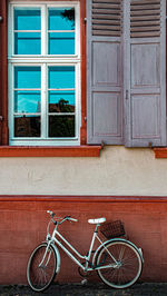 Bicycle parked against wall