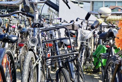 Close-up of bicycles parked on street