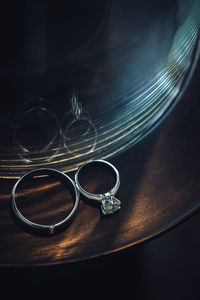 High angle view of wedding rings on table