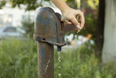 Pressurized water. water supply hydrant in the village. fresh water from the well.