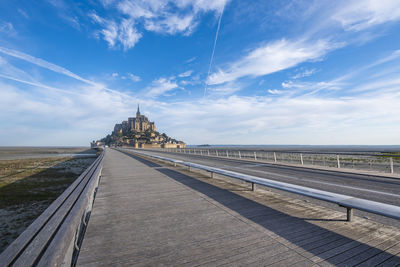 View of bridge against cloudy sky